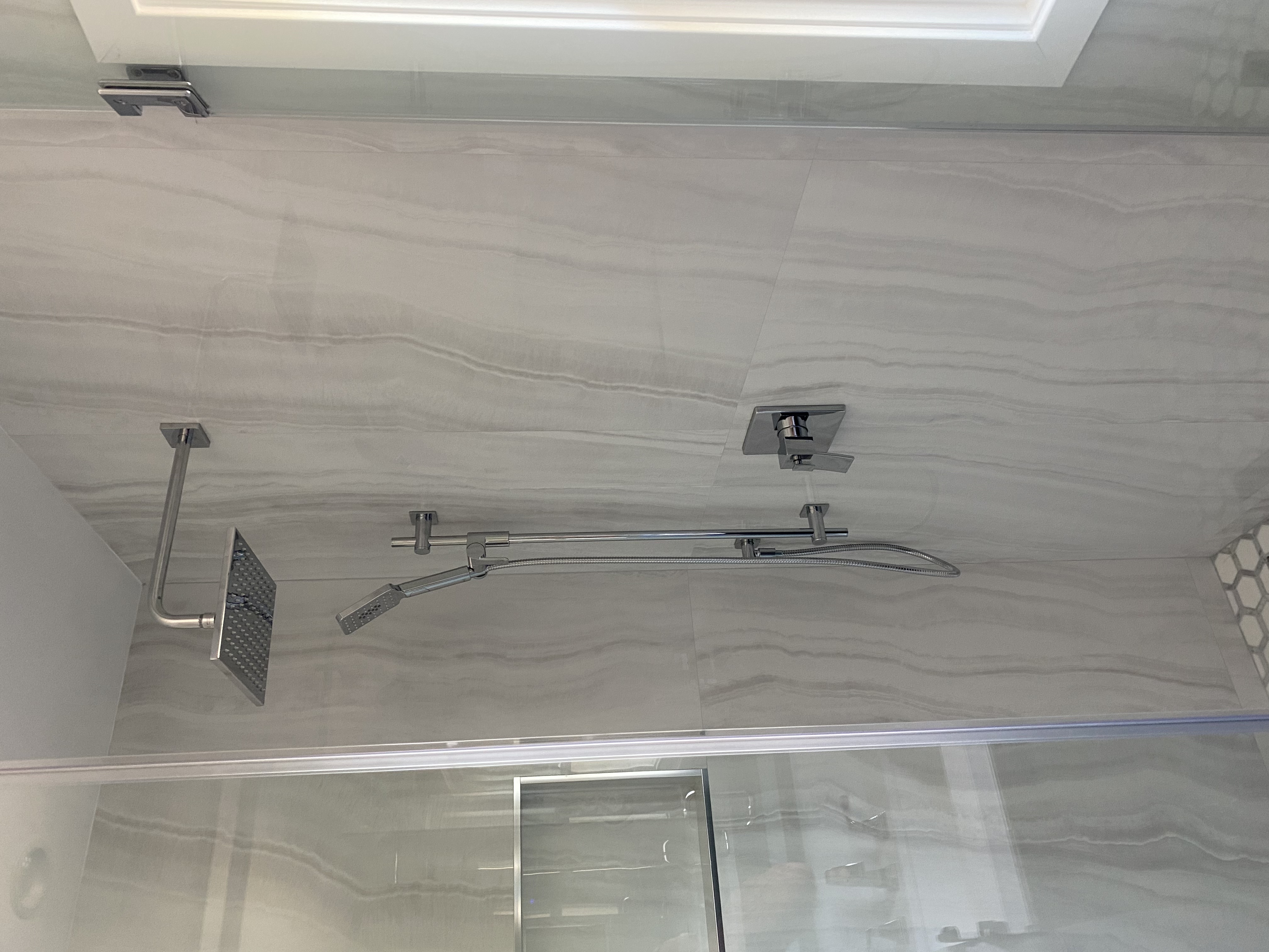 Custom shower stall with glass enclosure