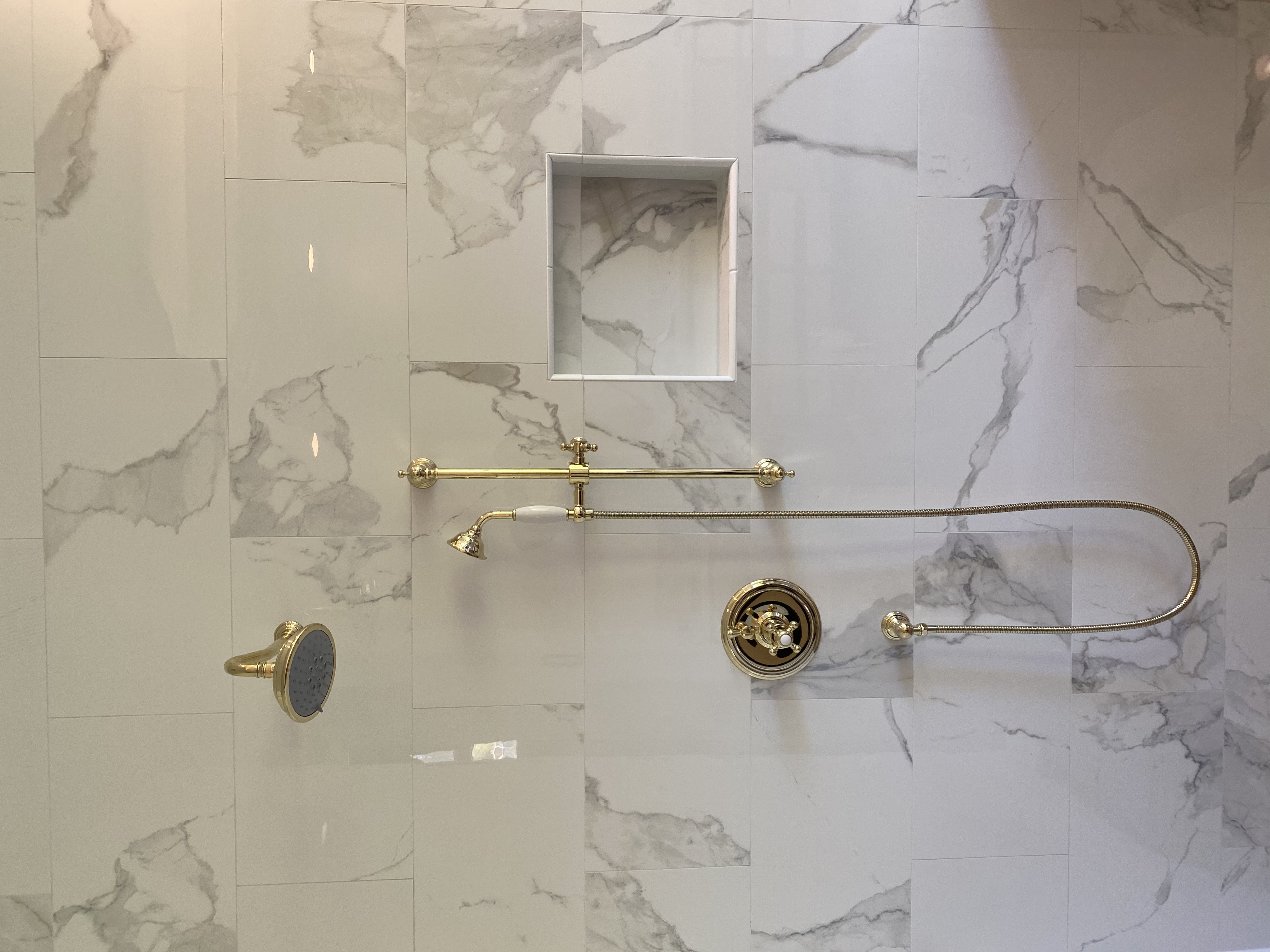 Shower stall with golden fixtures