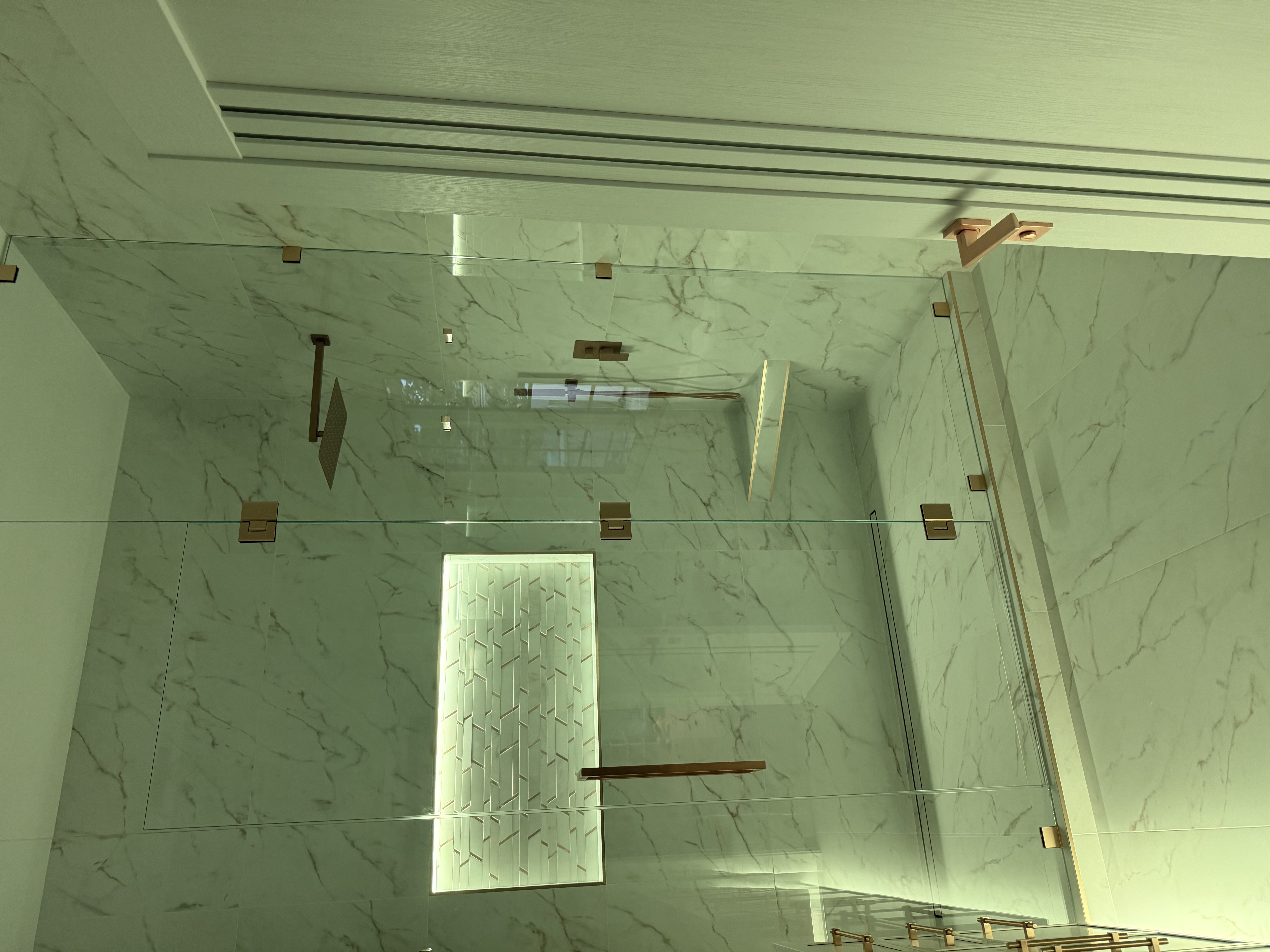 Italian marble bathroom with golden fixtures