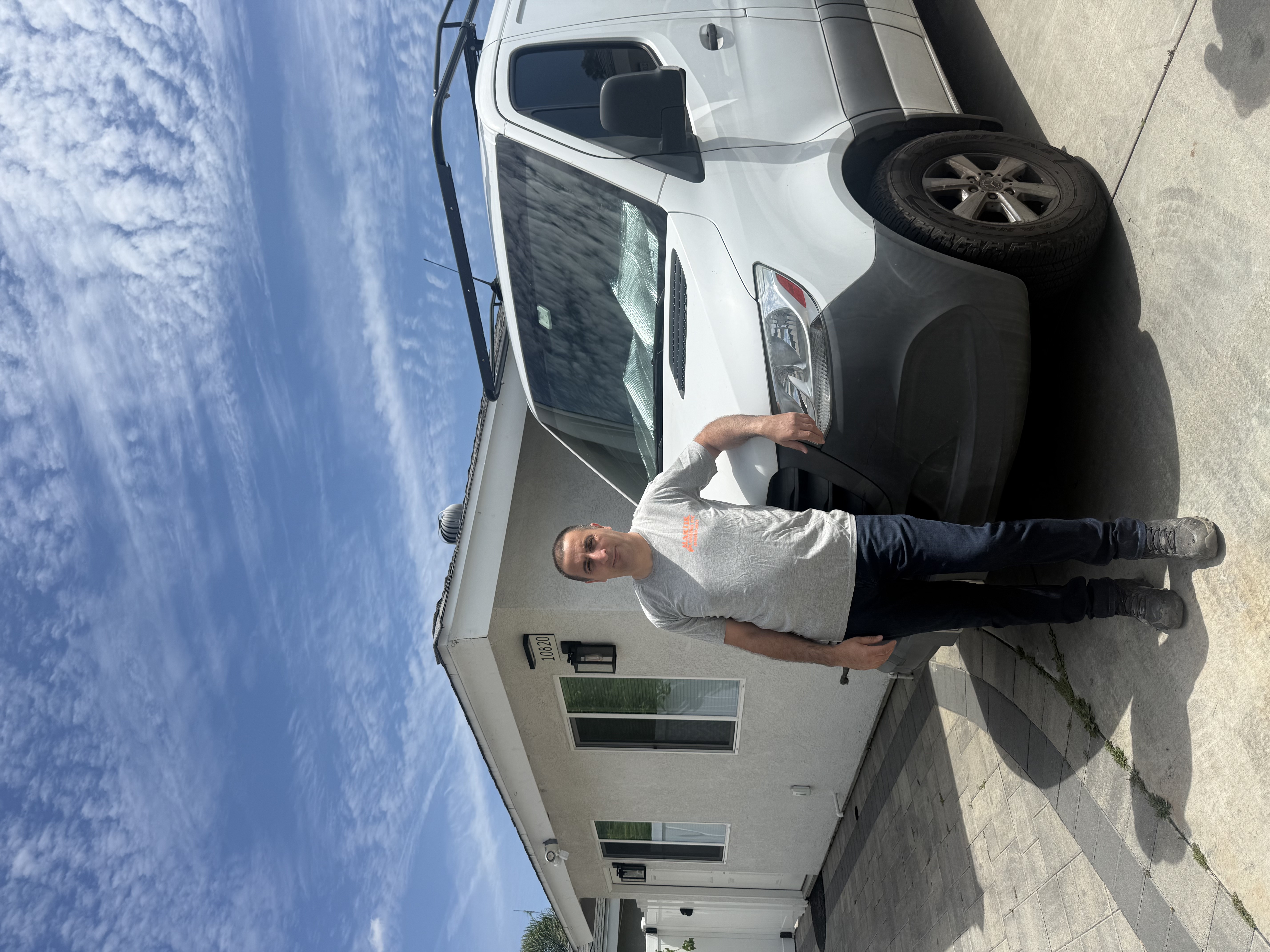 Martik — San Fernando Valley plumber standing in front of his work truck