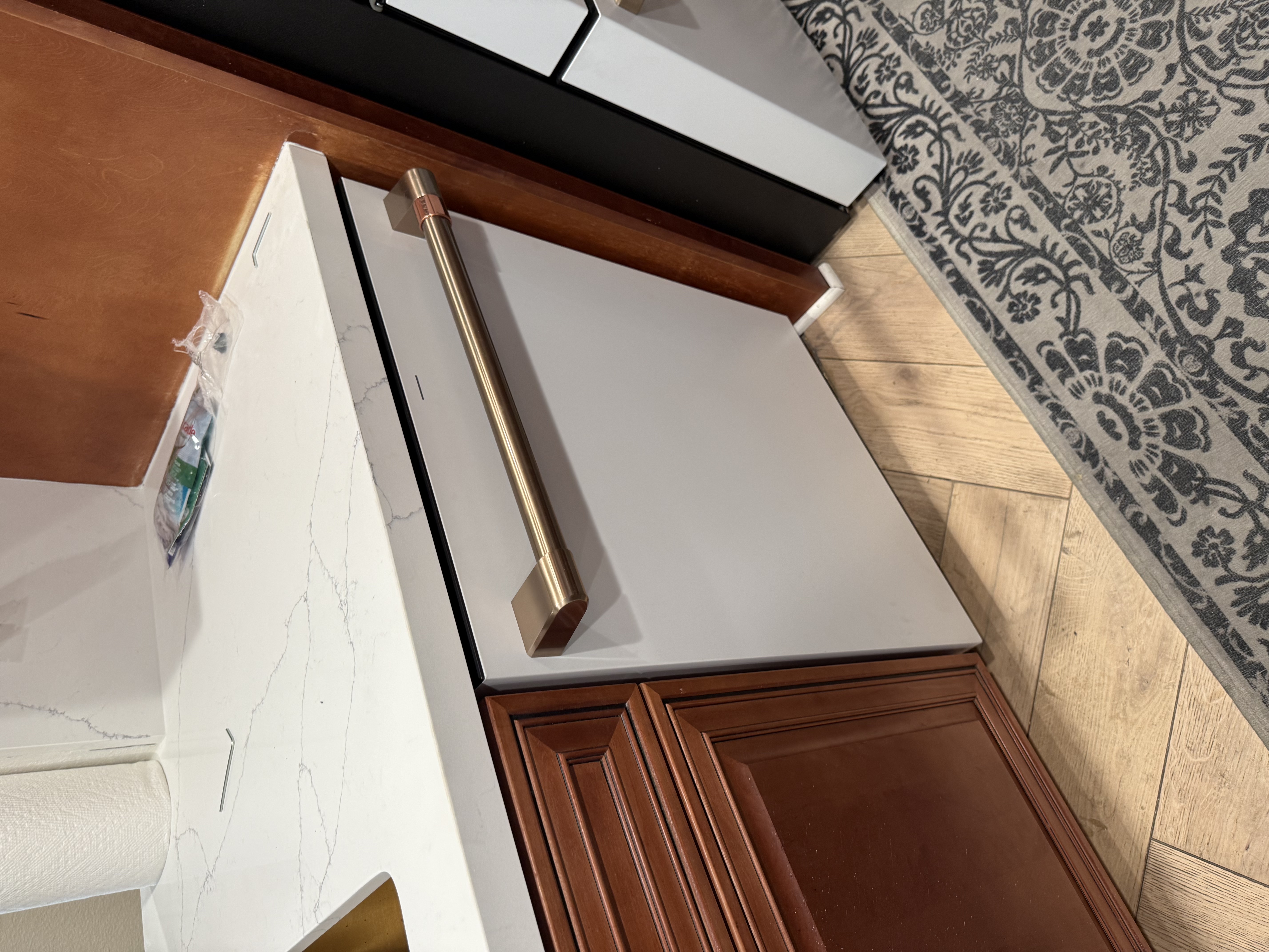 New dishwasher panel with brushed gold handle